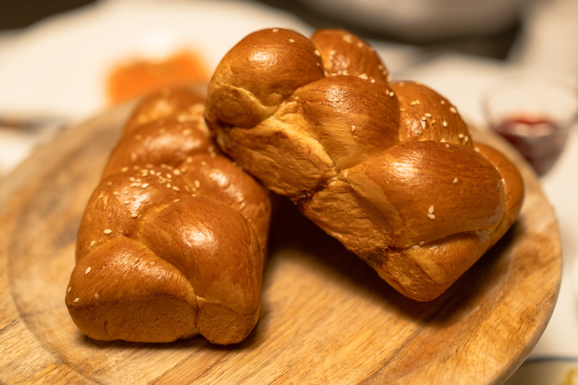 brown loaf breads on wooden plate